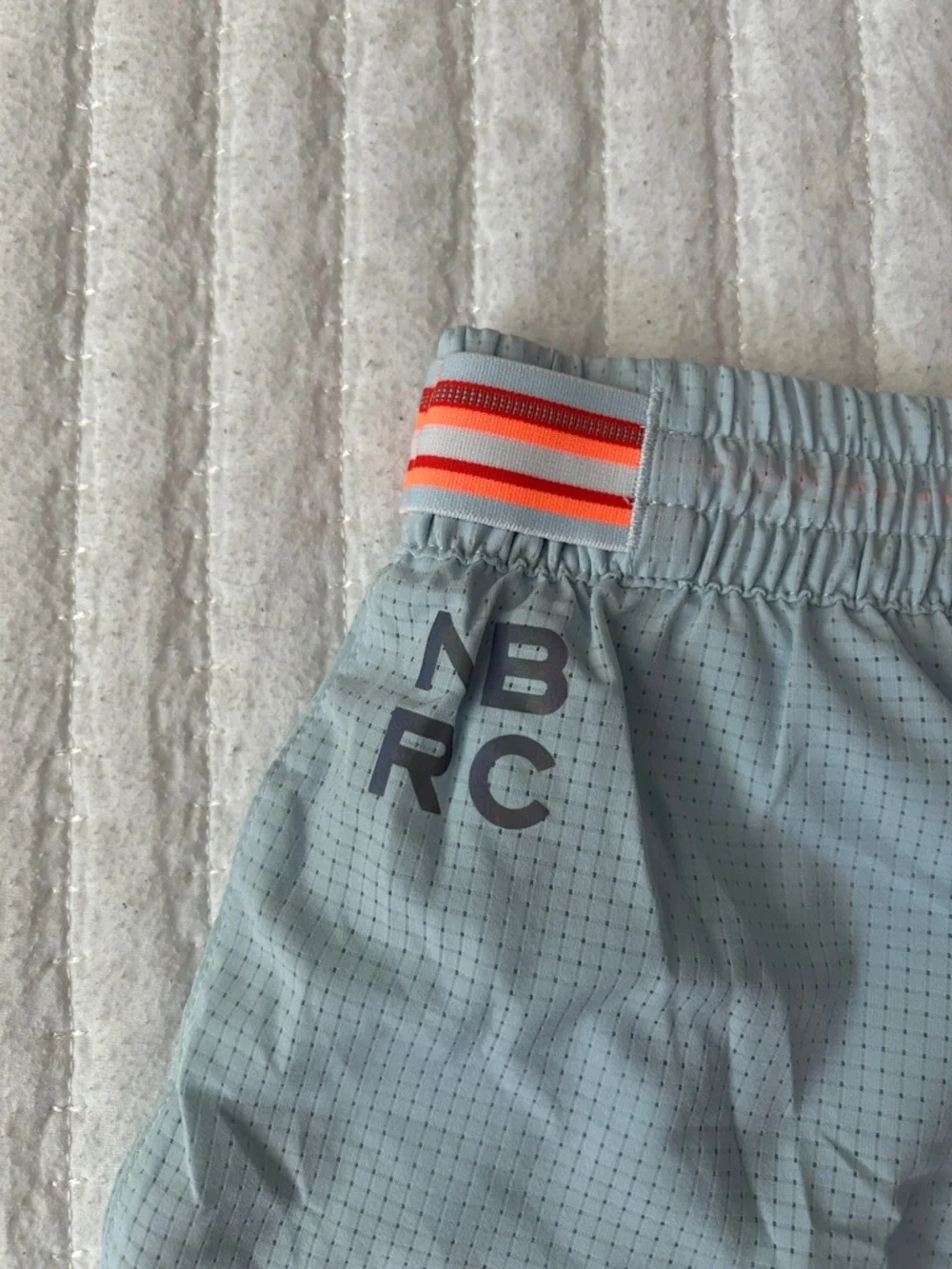 New Balance Light Blue Mesh Running Shorts with Orange Eyelets - Picture 5 of 8